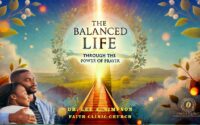 The Balanced Life. Man standing in light with arms spread.